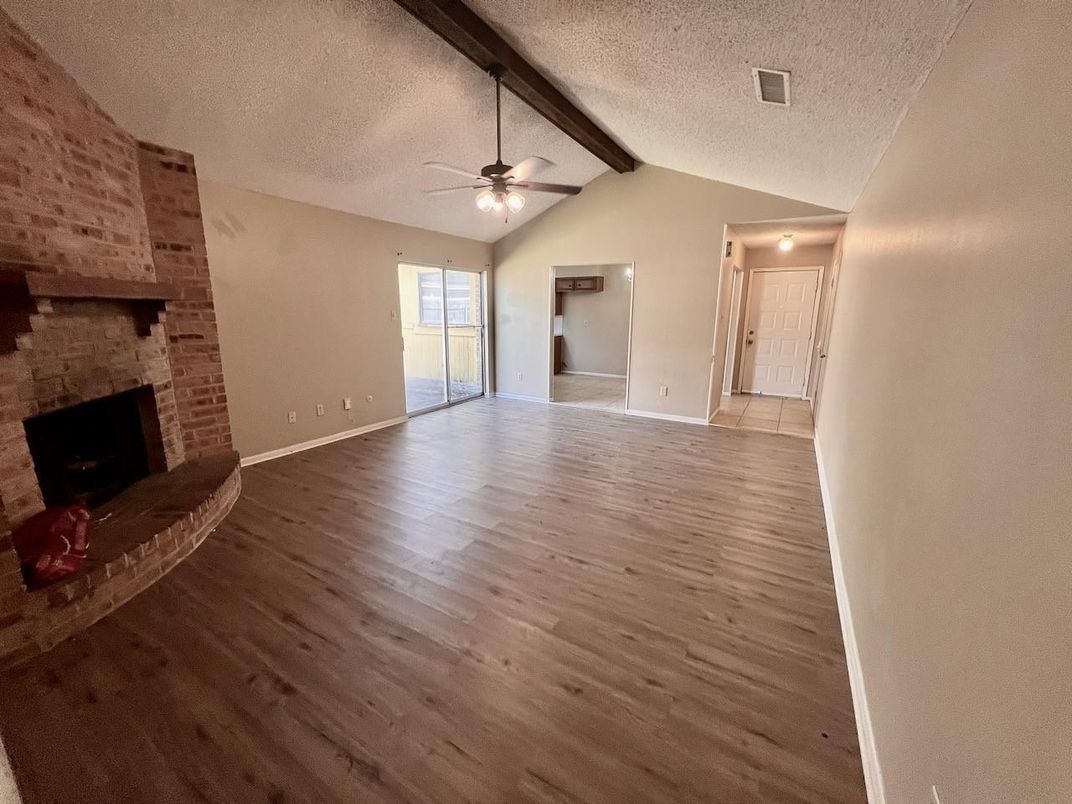 Empty room, Fireplace, Interior, Stone Walls, Wooden Beams, Wood Texture Flooring