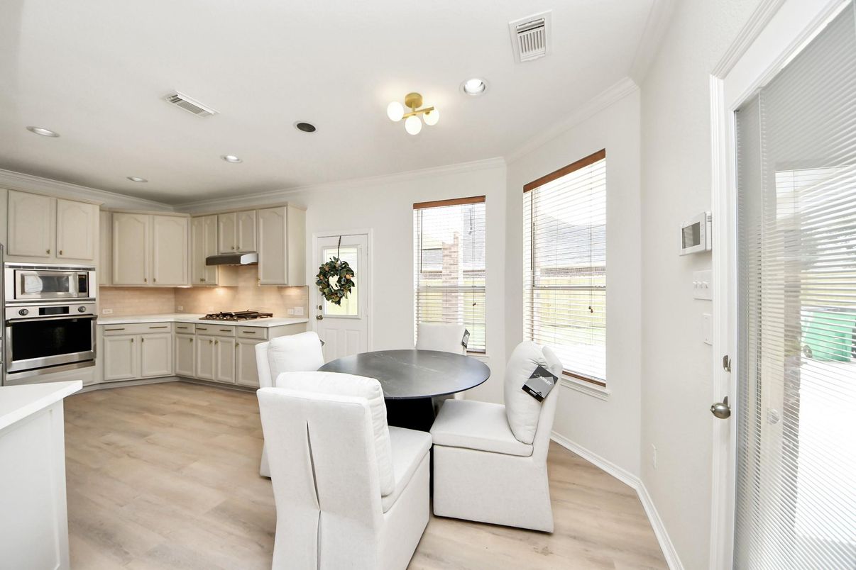 Dining room, Interior, Kitchen, Recessed Lighting, Stainless Steel Appliances, Wood Texture Flooring