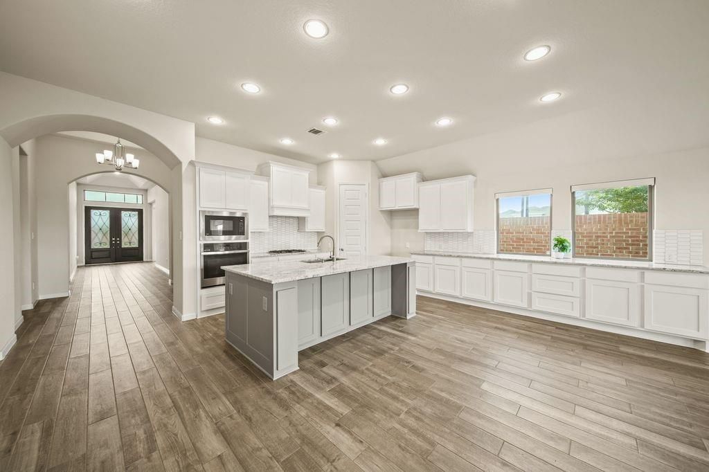 Chandelier, Interior, Kitchen, Recessed Lighting, Stainless Steel Appliances, Wood Texture Flooring
