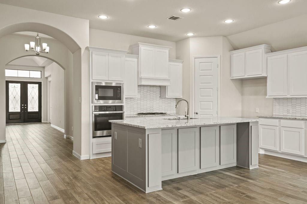 Chandelier, Interior, Kitchen, Recessed Lighting, Stainless Steel Appliances, Wood Texture Flooring