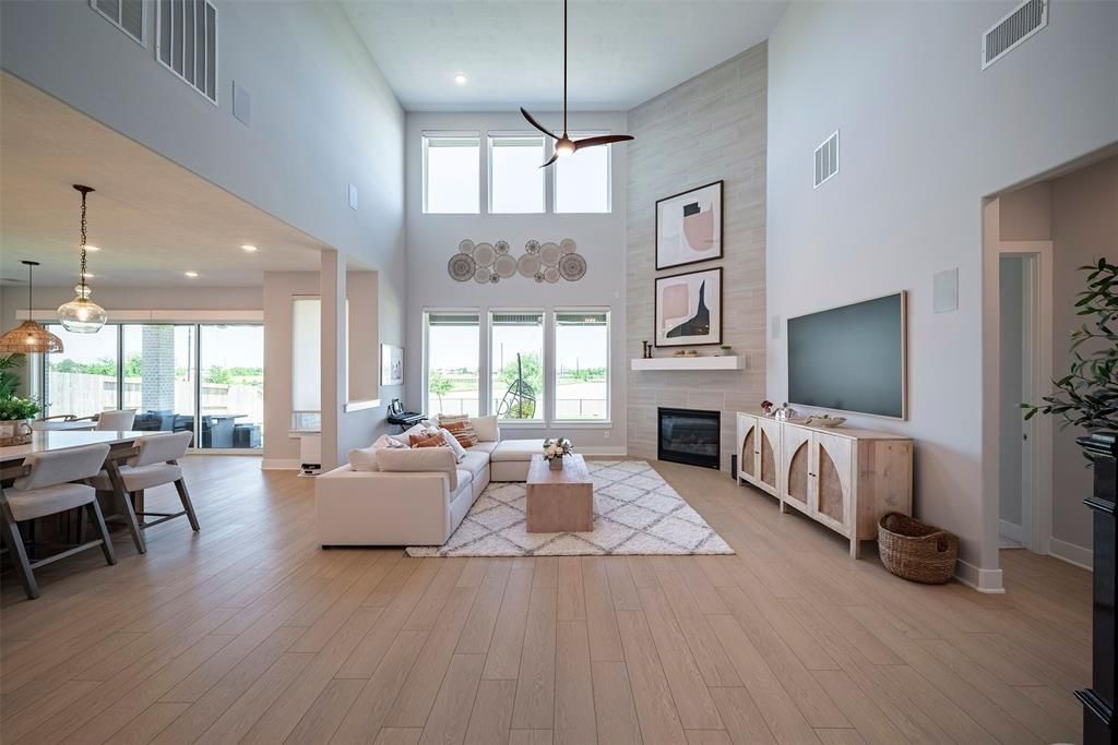 Dining room, Fireplace, Interior, Living room, Pendant Lights, Recessed Lighting, Wood Texture Flooring