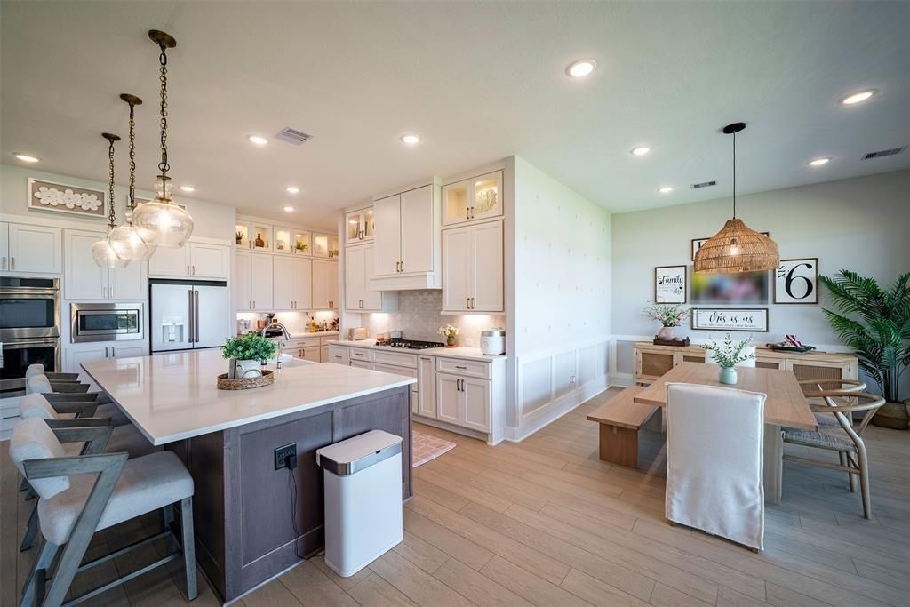 Dining room, Interior, Kitchen, Pendant Lights, Recessed Lighting, Stainless Steel Appliances, Wood Texture Flooring