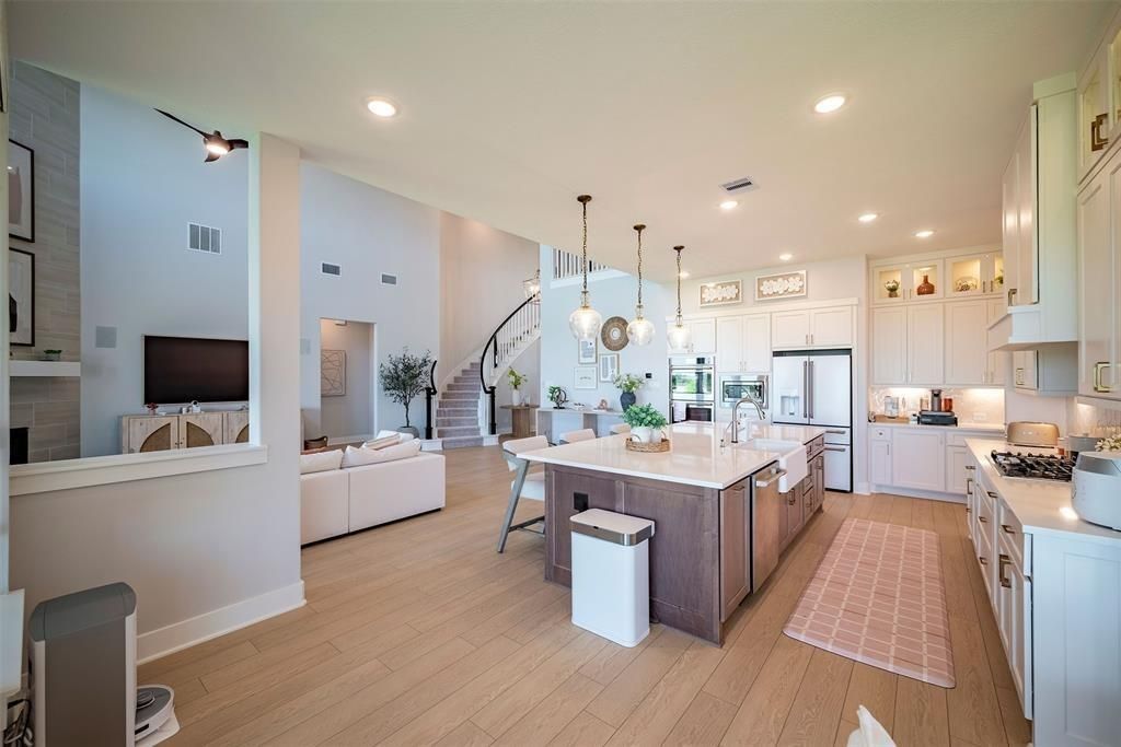 Dining room, Interior, Kitchen, Living room, Pendant Lights, Recessed Lighting, Stainless Steel Appliances, Wood Texture Flooring