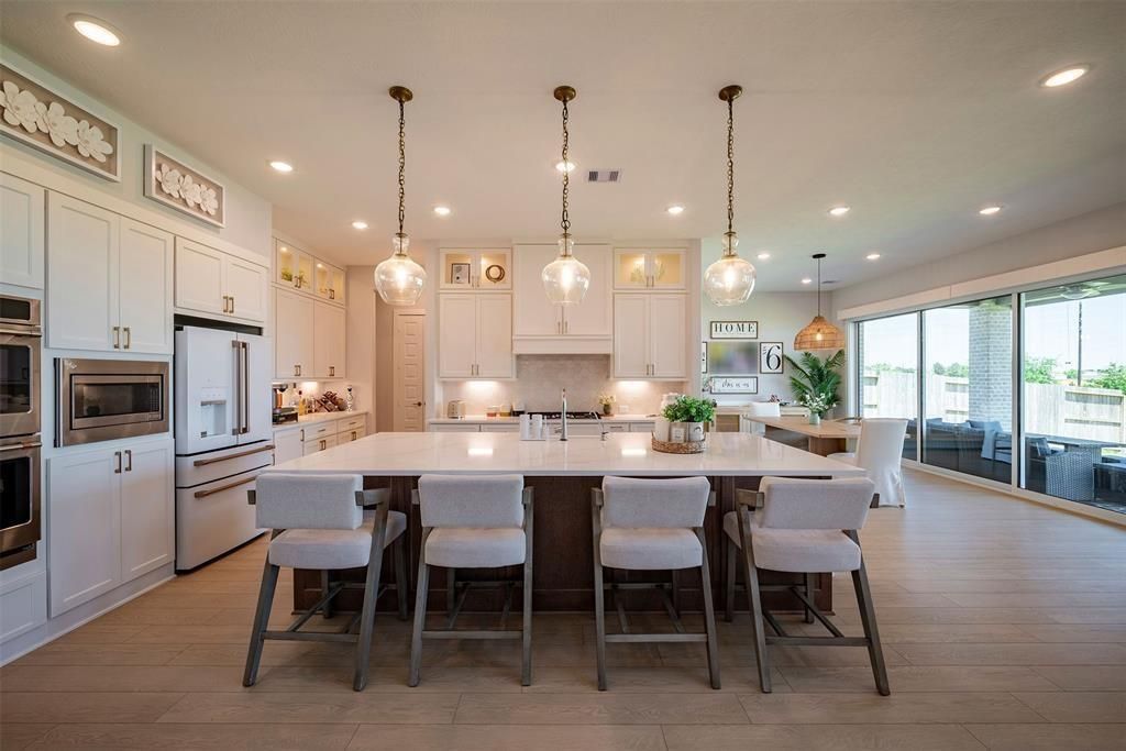 Dining room, Interior, Kitchen, Pendant Lights, Recessed Lighting, Stainless Steel Appliances, Wood Texture Flooring