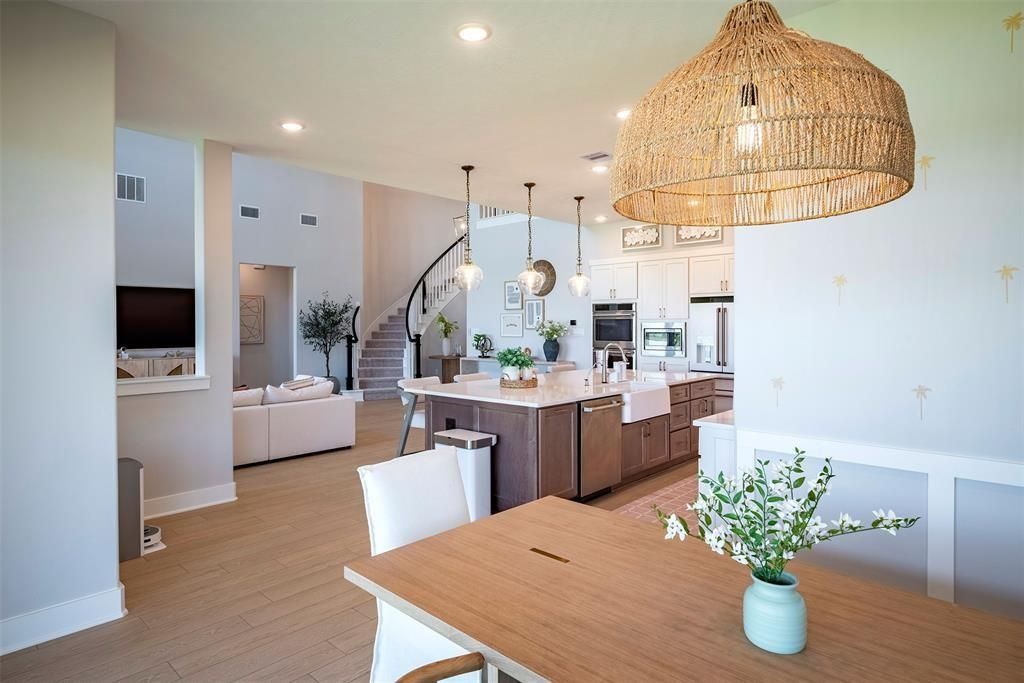 Dining room, Interior, Kitchen, Living room, Pendant Lights, Recessed Lighting, Stainless Steel Appliances, Wood Texture Flooring