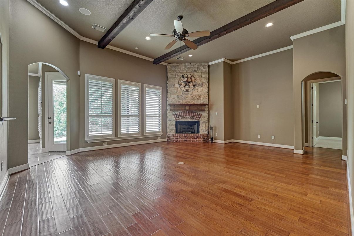 Empty room, Fireplace, Interior, Recessed Lighting, Stone Walls, Wooden Beams, Wood Texture Flooring
