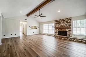 Empty room, Fireplace, Interior, Recessed Lighting, Stone Walls, Wooden Beams, Wood Texture Flooring