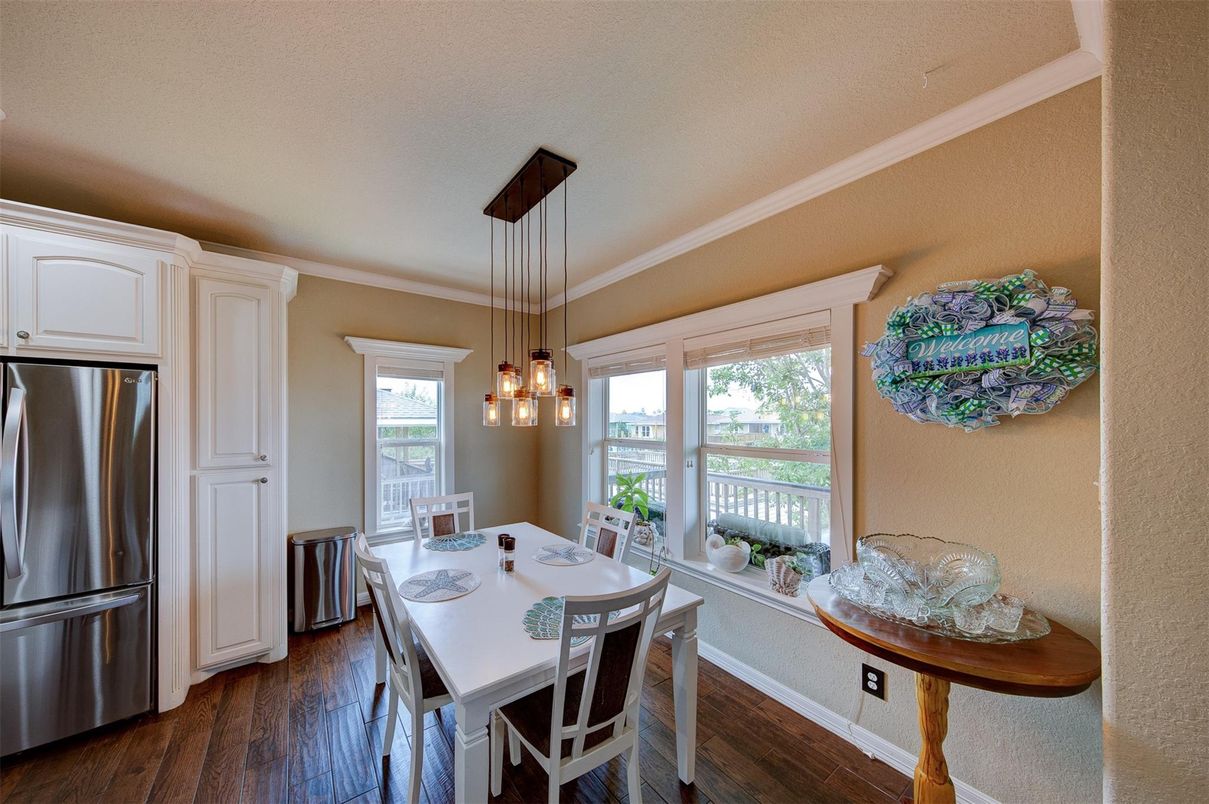 Dining room, Interior, Kitchen, Pendant Lights, Stainless Steel Appliances, Wood Texture Flooring