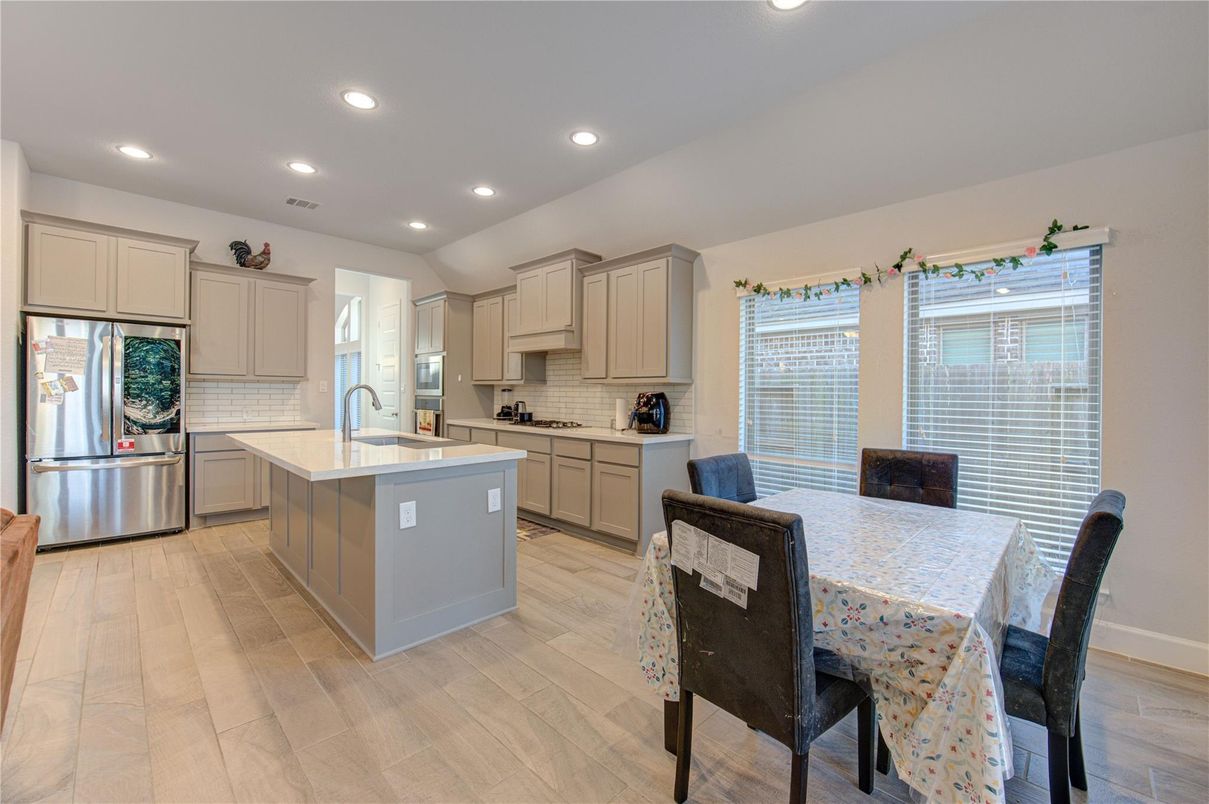 Dining room, Interior, Kitchen, Recessed Lighting, Stainless Steel Appliances, Wood Texture Flooring