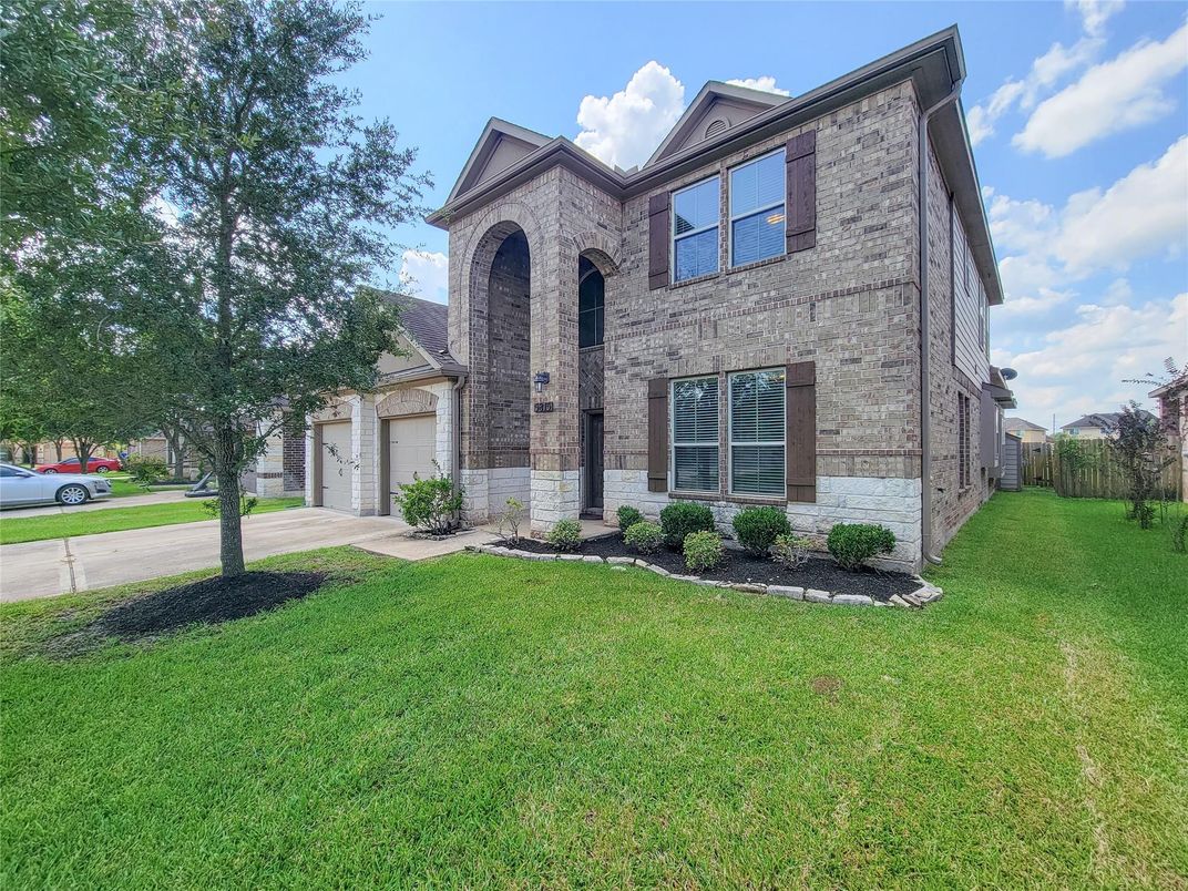 Attached, Backyard, Exterior, Facade, Brick Facade, Brick Traditional