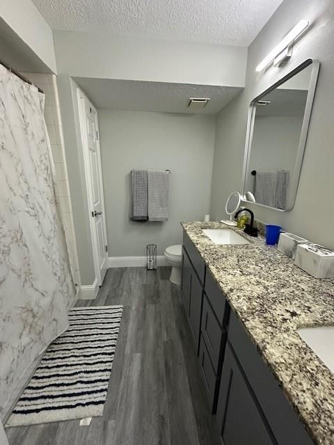 Bathroom, Dual Sink Vanities, Interior, Marble Walls, Wood Texture Flooring