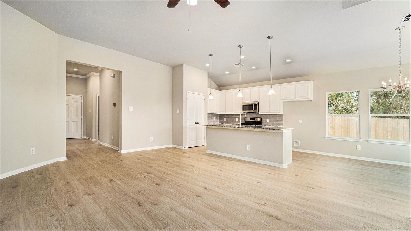 Empty room, Interior, Kitchen, Pendant Lights, Recessed Lighting, Stainless Steel Appliances, Wood Texture Flooring