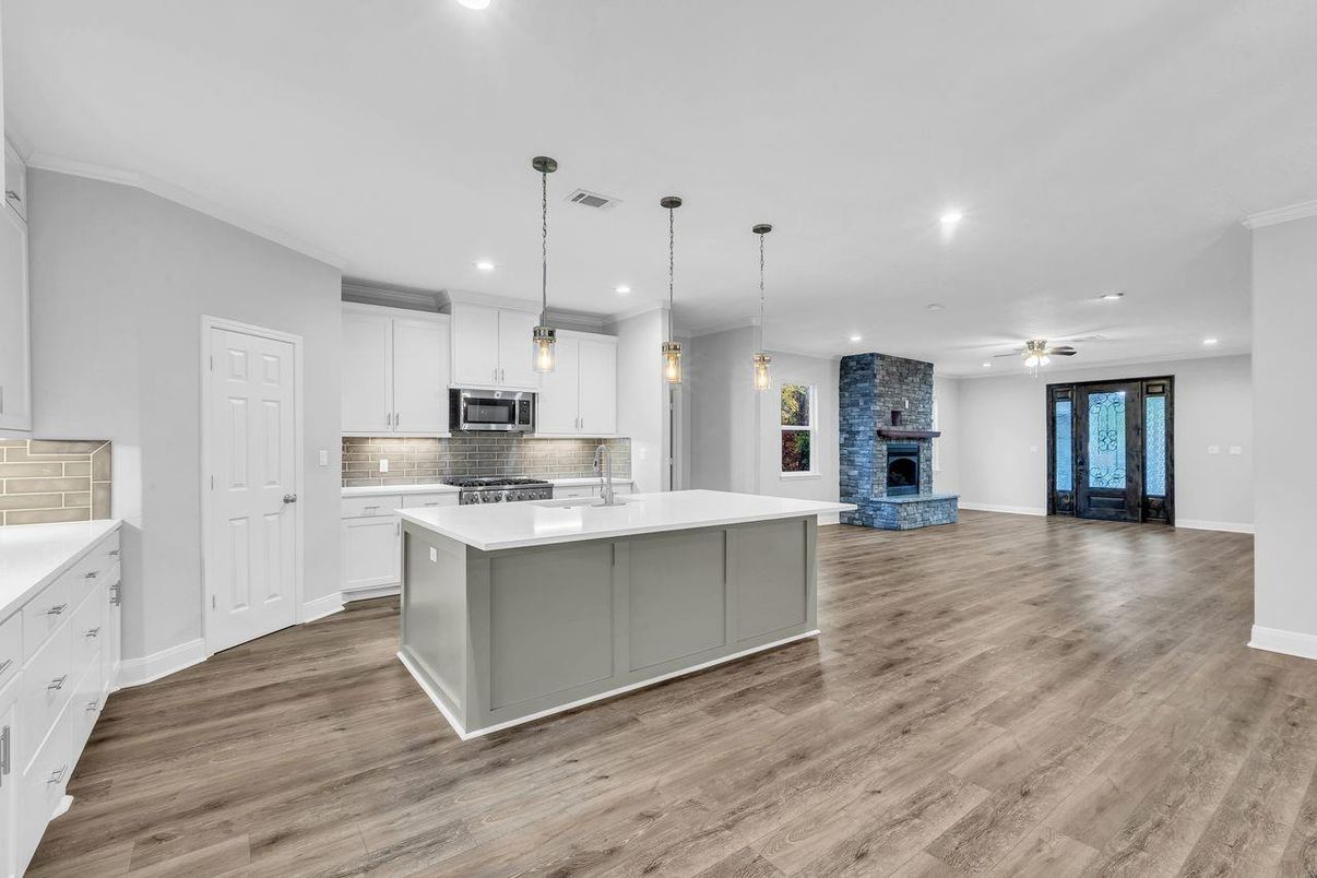 Fireplace, Interior, Kitchen, Pendant Lights, Recessed Lighting, Stainless Steel Appliances, Wood Texture Flooring