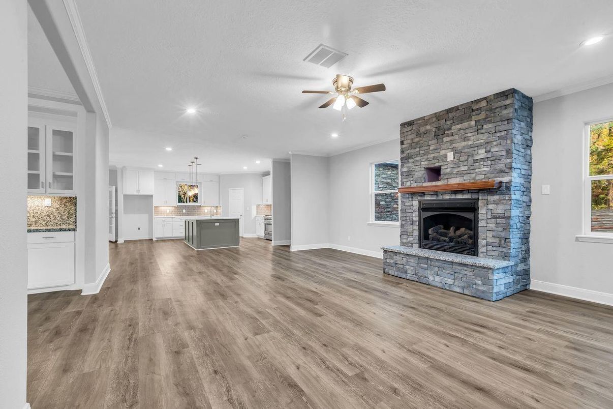 Empty room, Fireplace, Interior, Kitchen, Pendant Lights, Recessed Lighting, Stone Walls, Wood Texture Flooring