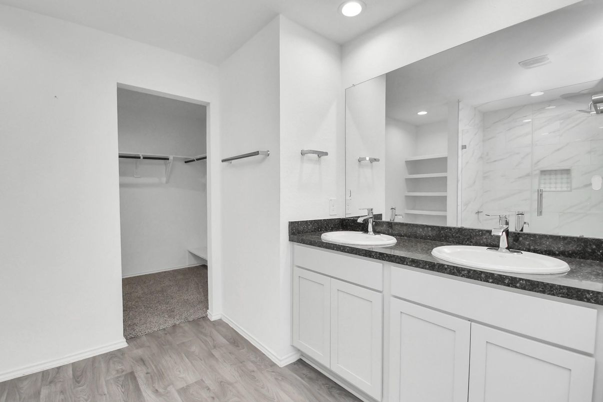 Bathroom, Dual Sink Vanities, Interior, Marble Walls, Recessed Lighting, Walk-in Closets, Wood Texture Flooring