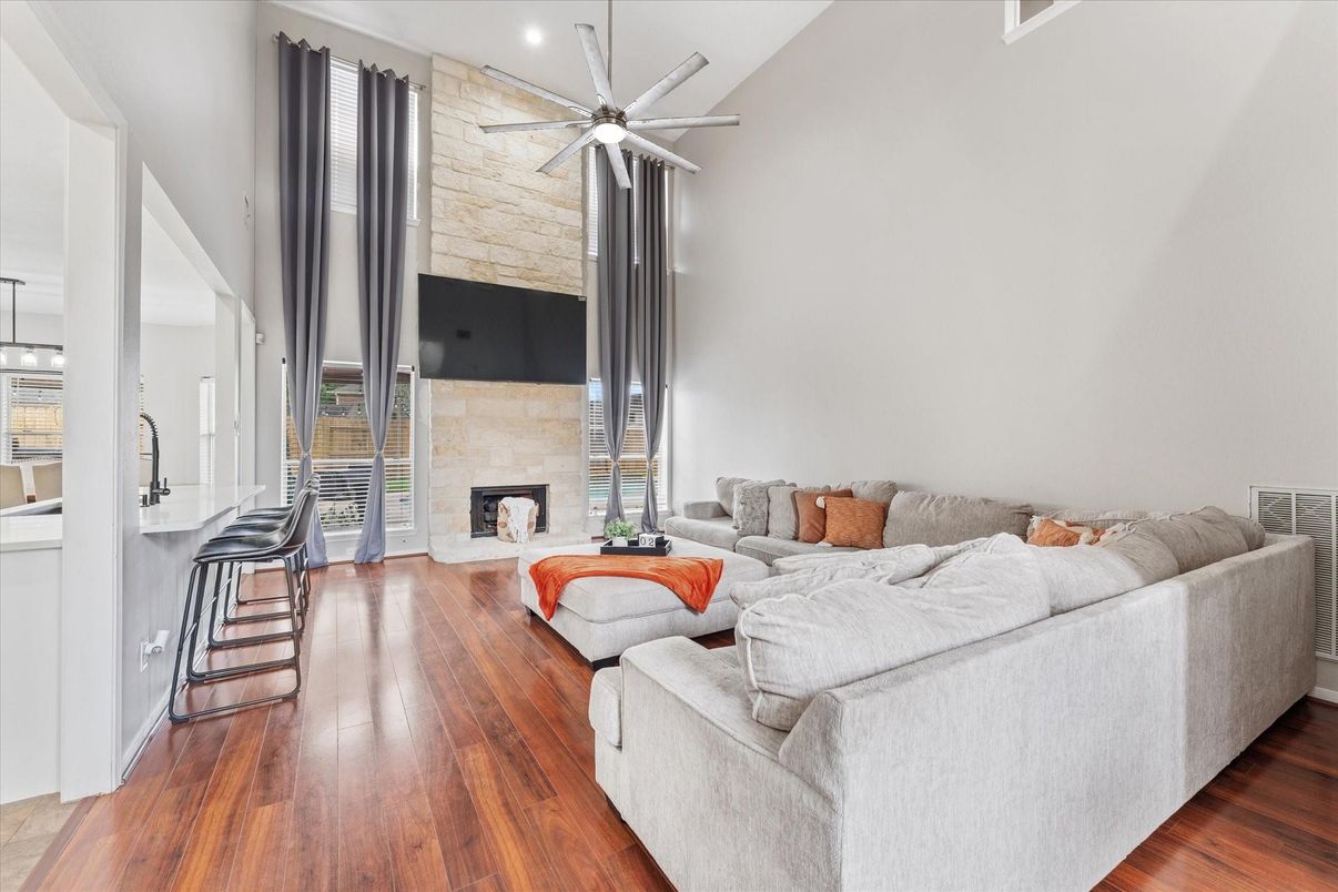 Fireplace, Interior, Living room, Recessed Lighting, Stone Walls, Wood Texture Flooring