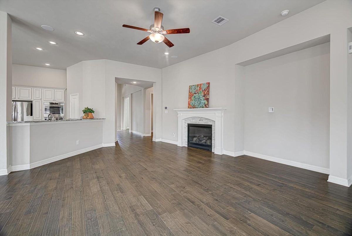 Empty room, Fireplace, Interior, Kitchen, Recessed Lighting, Wood Texture Flooring