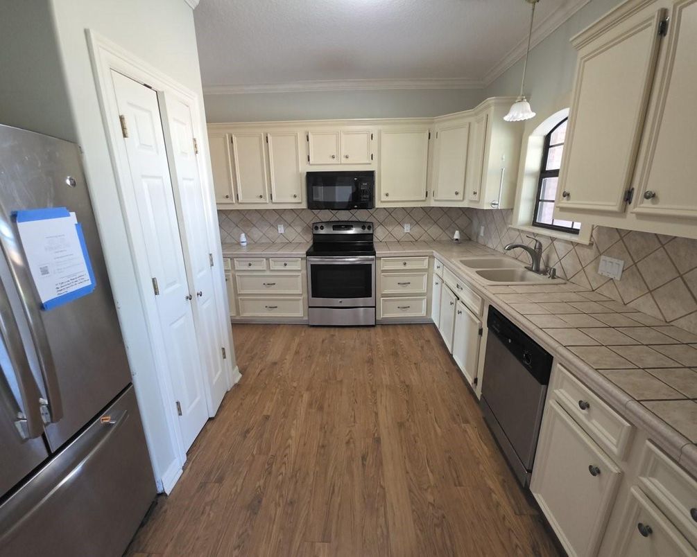 Interior, Kitchen, Pendant Lights, Stainless Steel Appliances, Tile Countertops, Wood Texture Flooring