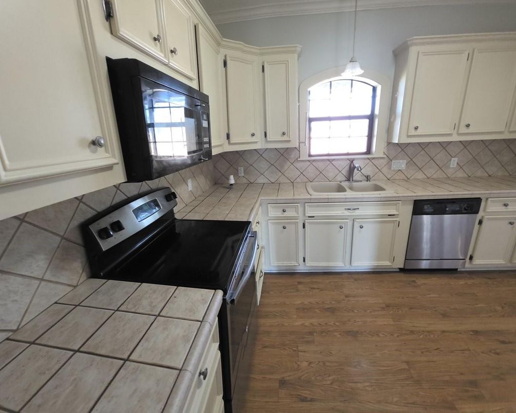 Interior, Kitchen, Pendant Lights, Tile Countertops, Wood Texture Flooring