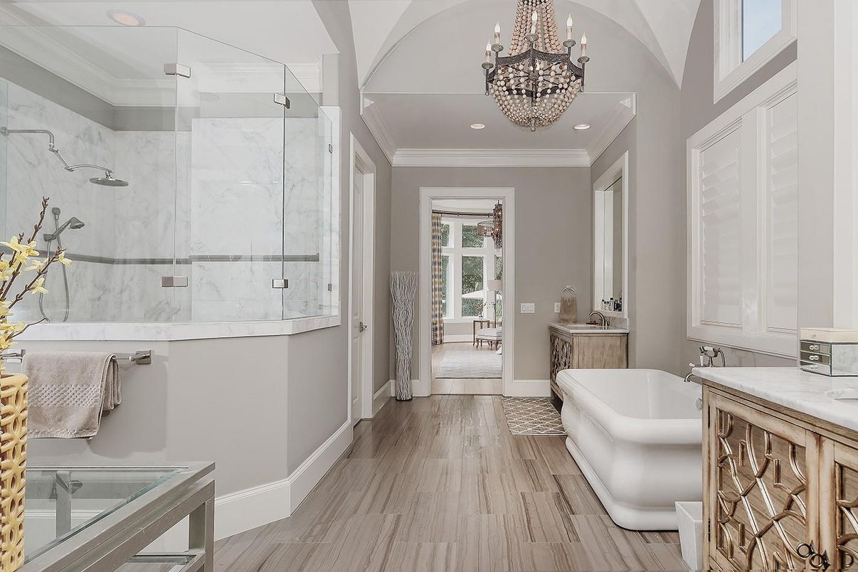 Bathroom, Chandelier, Free Standing Baths, Glass Shower, Interior, Marble Walls, Recessed Lighting, Wood Texture Flooring