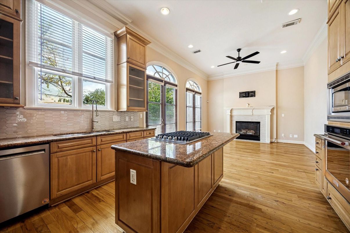 Fireplace, Interior, Kitchen, Recessed Lighting, Stainless Steel Appliances, Wood Texture Flooring