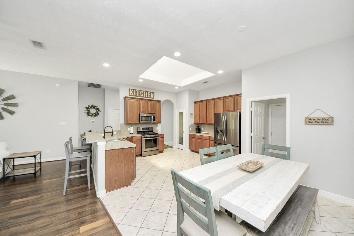 Dining room, Interior, Kitchen, Recessed Lighting, Stainless Steel Appliances, Wood Texture Flooring