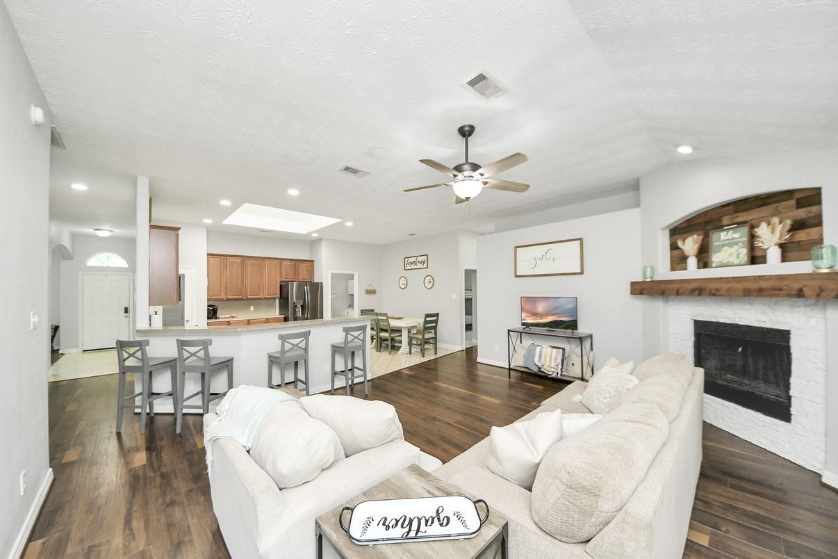 Dining room, Fireplace, Interior, Kitchen, Living room, Recessed Lighting, Wood Texture Flooring