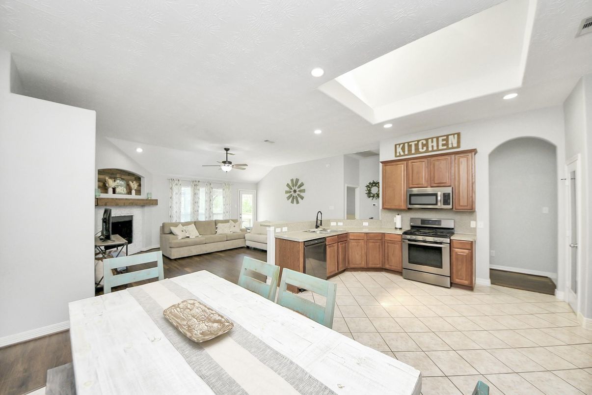 Fireplace, Interior, Kitchen, Living room, Recessed Lighting, Stainless Steel Appliances, Wood Texture Flooring