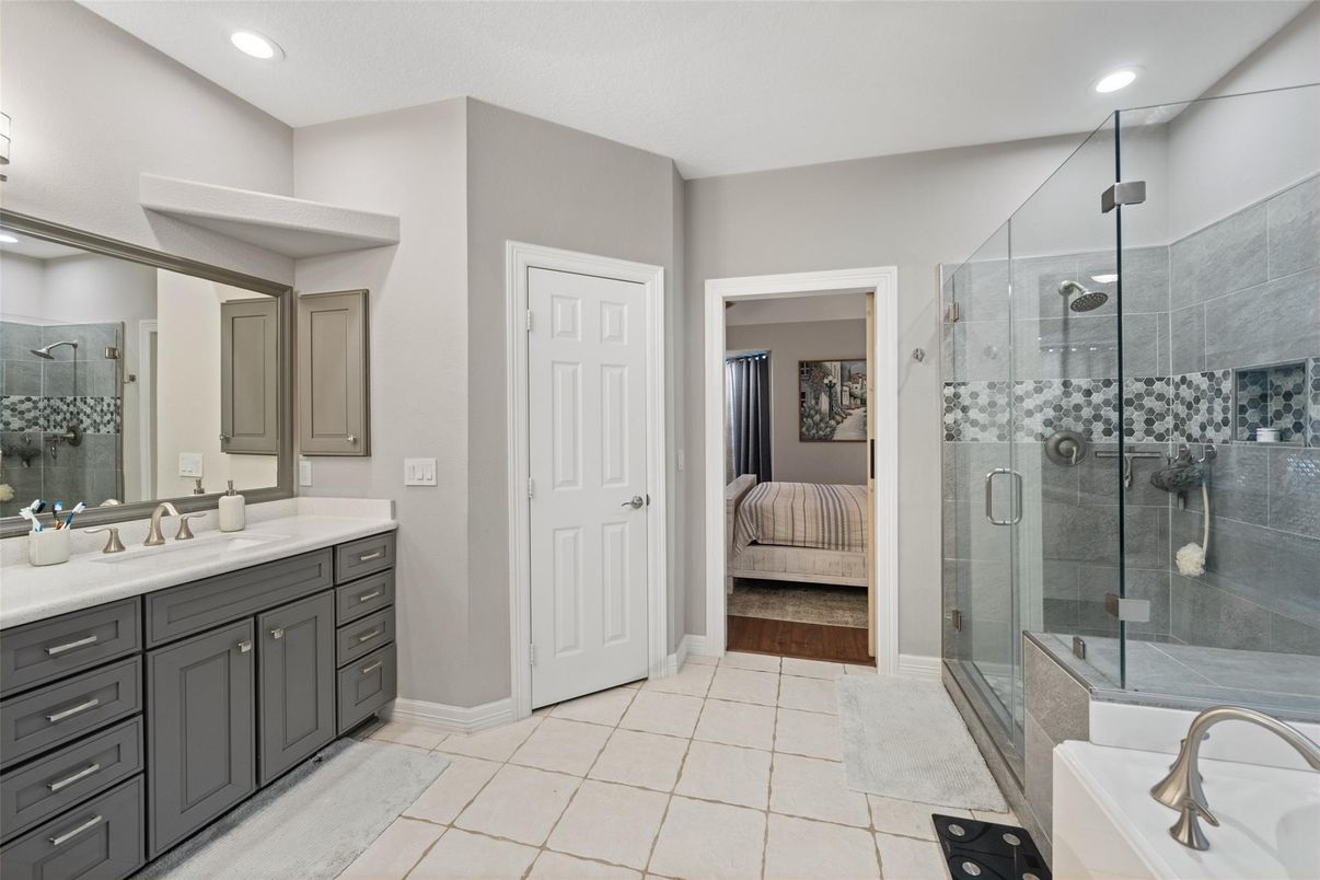 Bathroom, Bedroom, Dual Sink Vanities, Glass Shower, Interior, Recessed Lighting, Wood Texture Flooring
