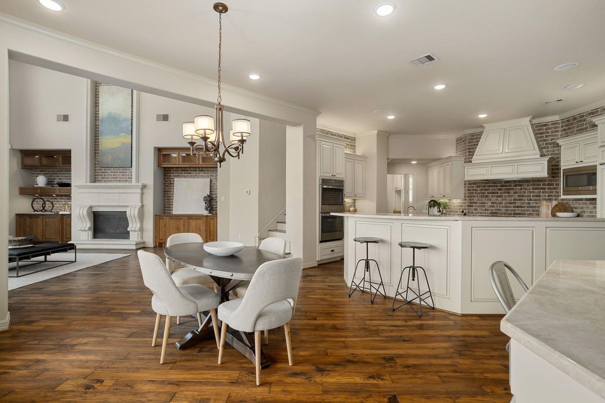 Chandelier, Dining room, Fireplace, Interior, Kitchen, Recessed Lighting, Stainless Steel Appliances, Wood Texture Flooring