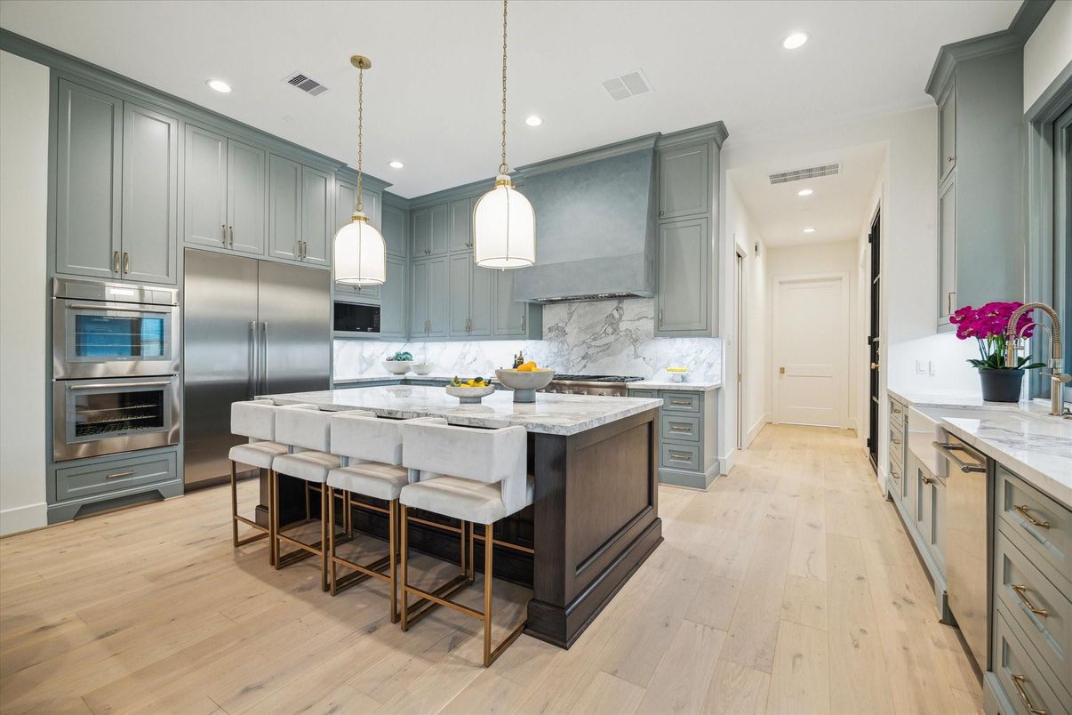 Interior, Kitchen, Marble Walls, Pendant Lights, Recessed Lighting, Stainless Steel Appliances, Wood Texture Flooring