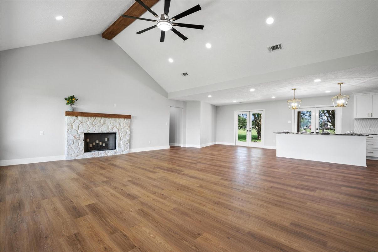 Chandelier, Empty room, Fireplace, Interior, Pendant Lights, Recessed Lighting, Wooden Beams, Wood Texture Flooring