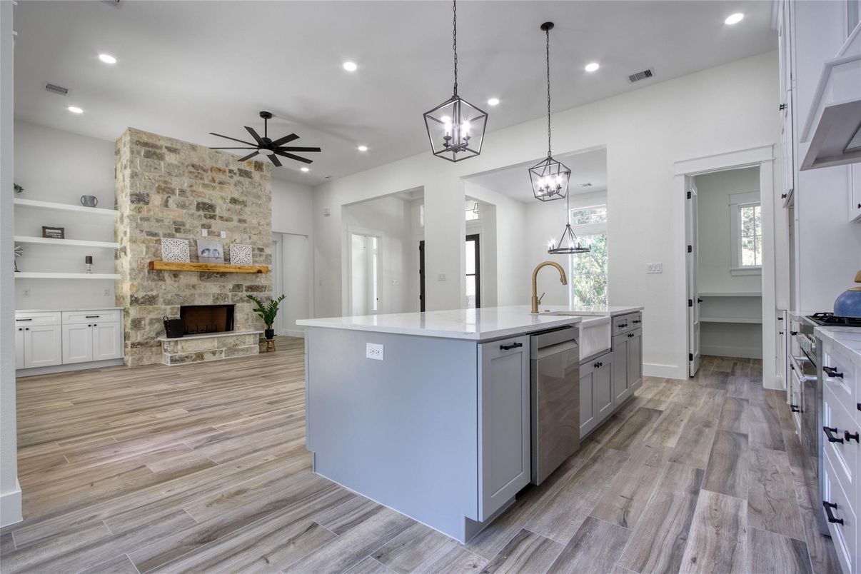 Fireplace, Interior, Kitchen, Pendant Lights, Recessed Lighting, Stone Walls, Wood Texture Flooring