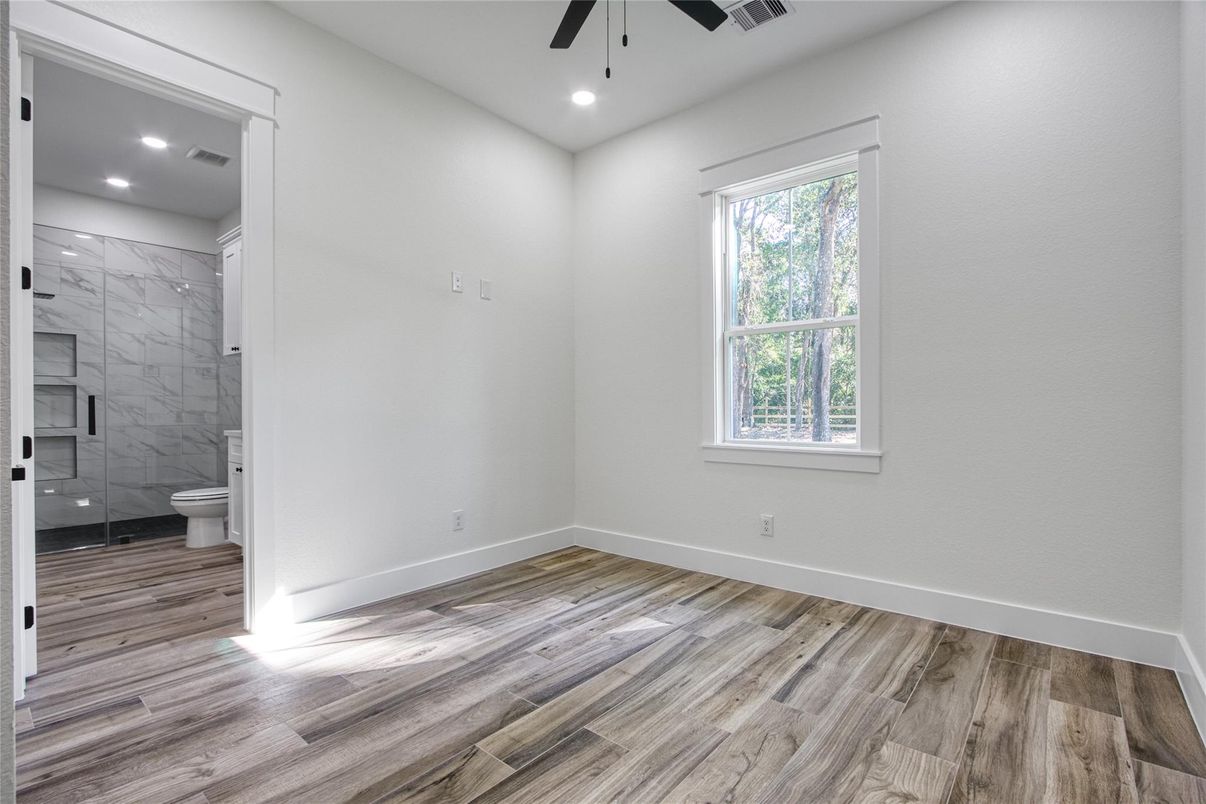 Bathroom, Empty room, Glass Shower, Interior, Marble Walls, Recessed Lighting, Wood Texture Flooring