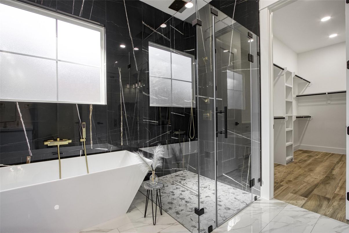 Bathroom, Free Standing Baths, Glass Shower, Interior, Marble, Marble Walls, Recessed Lighting, Walk-in Closets, Wood Texture Flooring