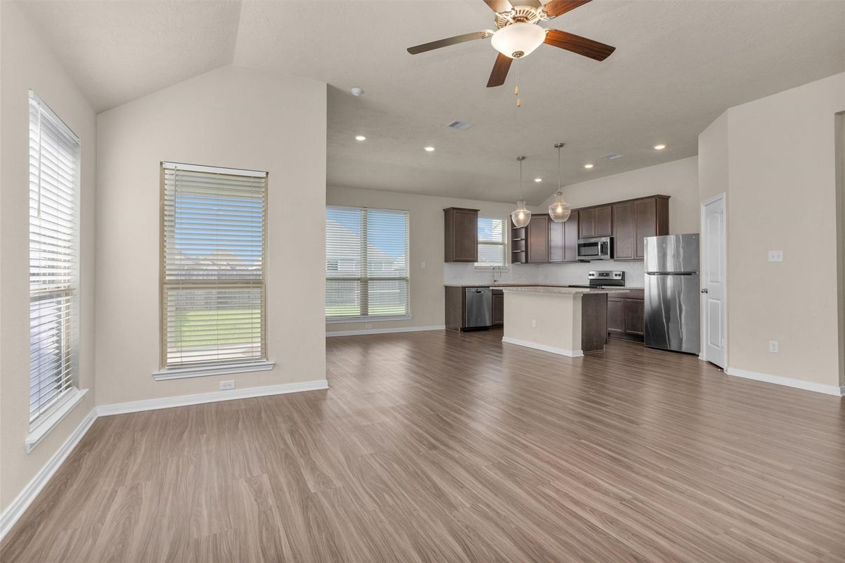 Empty room, Interior, Kitchen, Pendant Lights, Recessed Lighting, Stainless Steel Appliances, Wood Texture Flooring