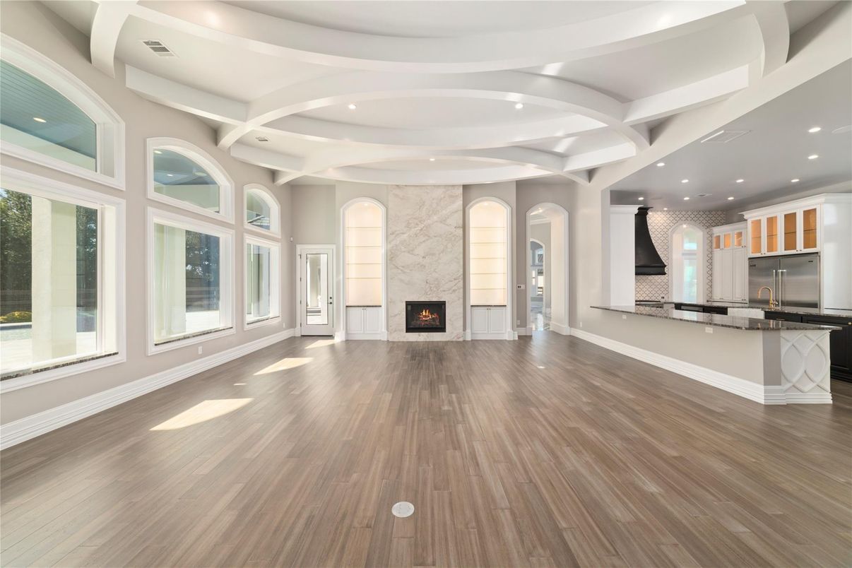 Empty room, Fireplace, Interior, Kitchen, Recessed Lighting, Wood Texture Flooring