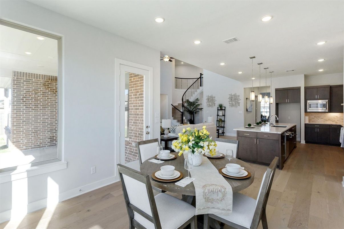 Dining room, Interior, Kitchen, Pendant Lights, Recessed Lighting, Stainless Steel Appliances, Wood Texture Flooring