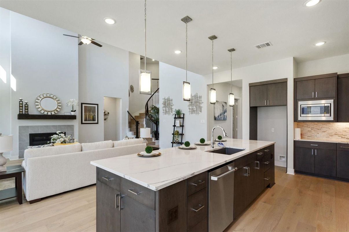 Fireplace, Interior, Kitchen, Living room, Pendant Lights, Recessed Lighting, Stainless Steel Appliances, Wood Texture Flooring