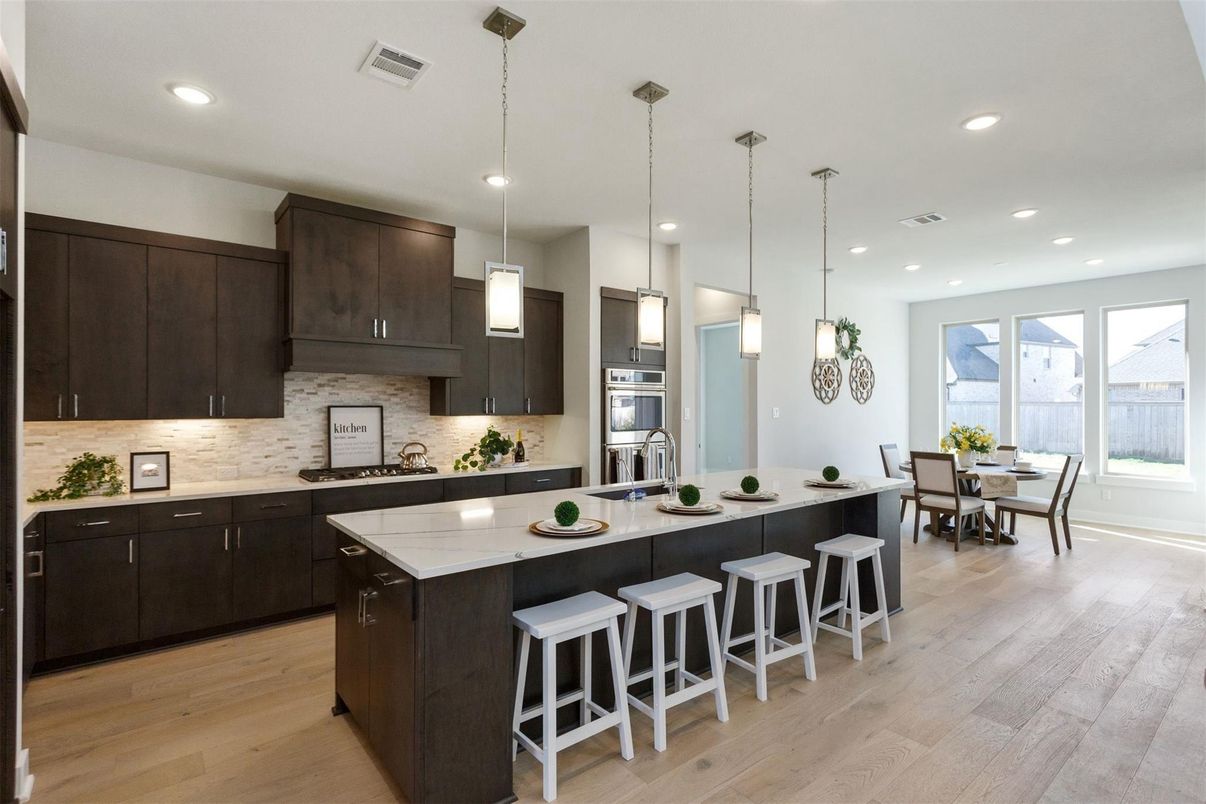 Dining room, Interior, Kitchen, Pendant Lights, Recessed Lighting, Stainless Steel Appliances, Wood Texture Flooring
