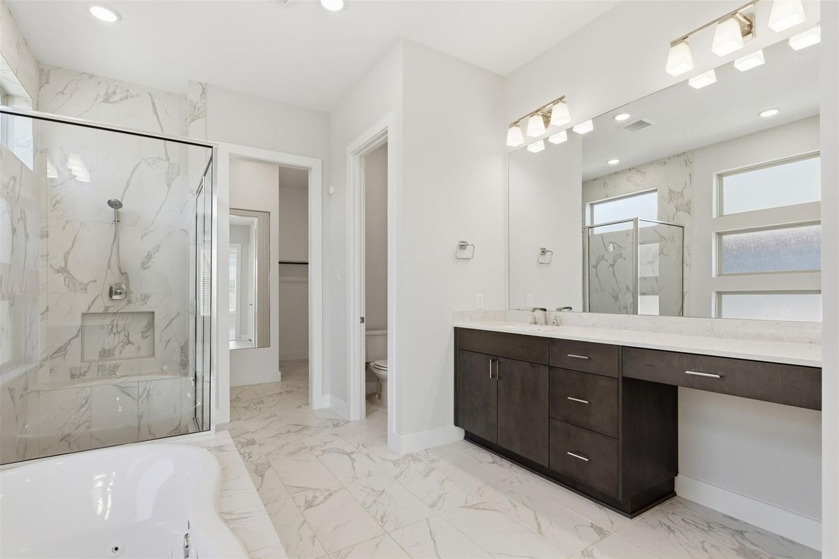 Bathroom, Dual Sink Vanities, Glass Shower, Interior, Marble, Marble Walls, Recessed Lighting