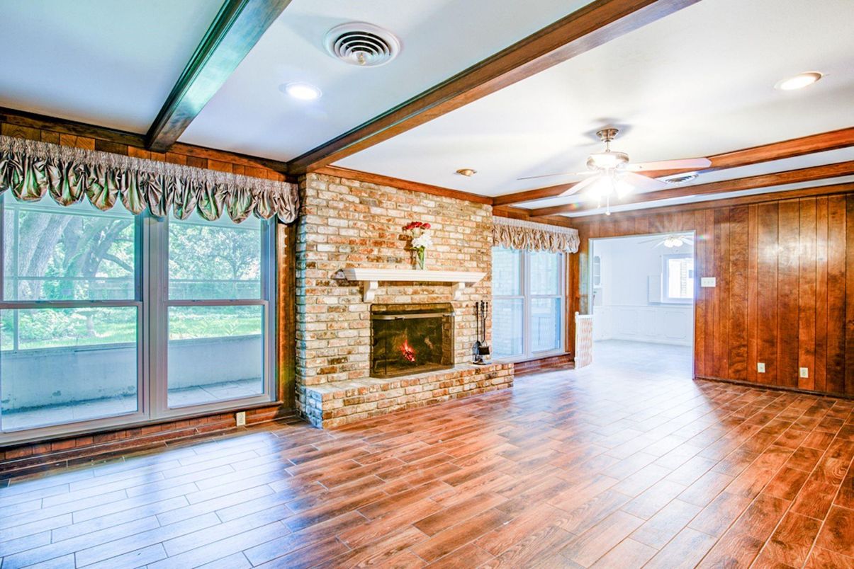 Empty room, Fireplace, Interior, Recessed Lighting, Stone Walls, Wood Texture Flooring