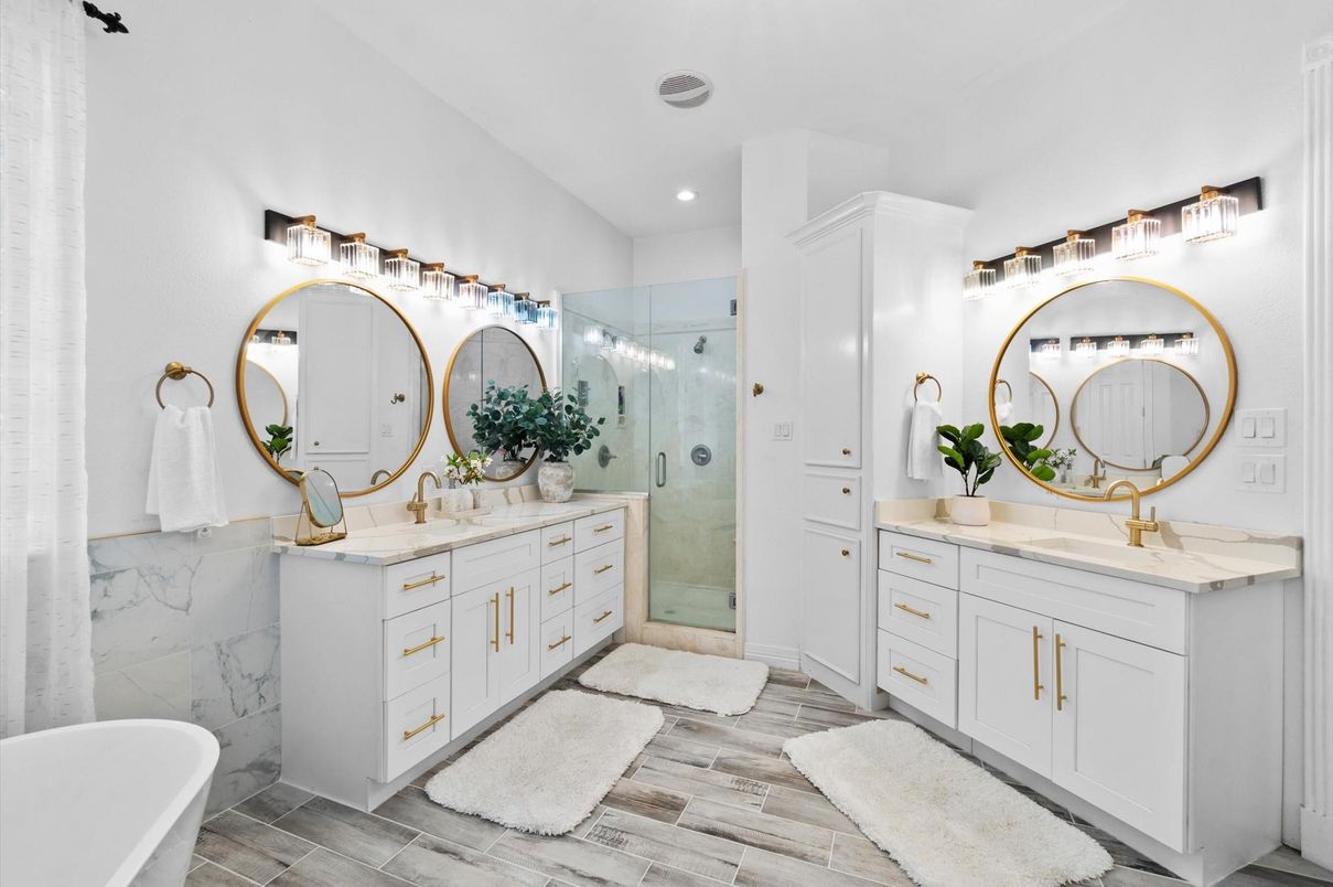 Bathroom, Dual Sink Vanities, Free Standing Baths, Glass Shower, Interior, Marble Walls, Recessed Lighting, Wood Texture Flooring