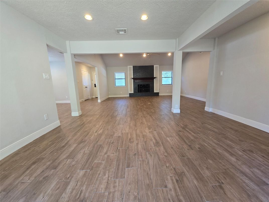 Empty room, Fireplace, Interior, Recessed Lighting, Wood Texture Flooring