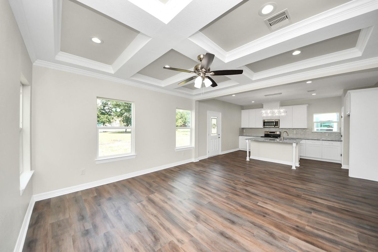 Chandelier, Empty room, Interior, Kitchen, Recessed Lighting, Stainless Steel Appliances, Wood Texture Flooring