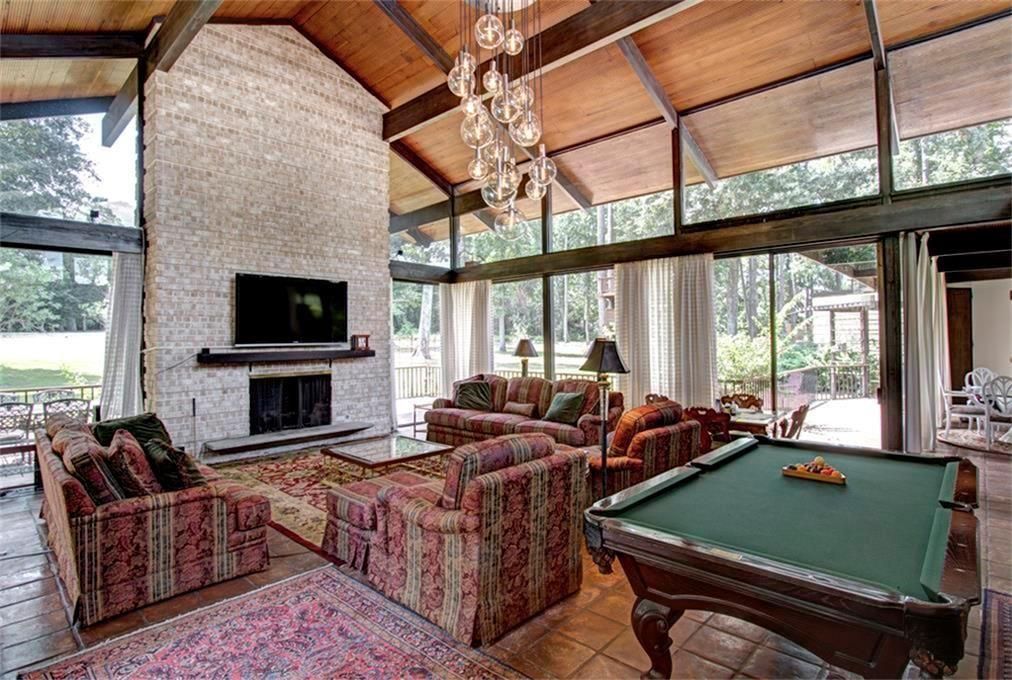 Billiard Table, Chandelier, Fireplace, Game Room, Interior, Living room, Pendant Lights, Stone Walls, Wooden Beams, Wooden Ceilings