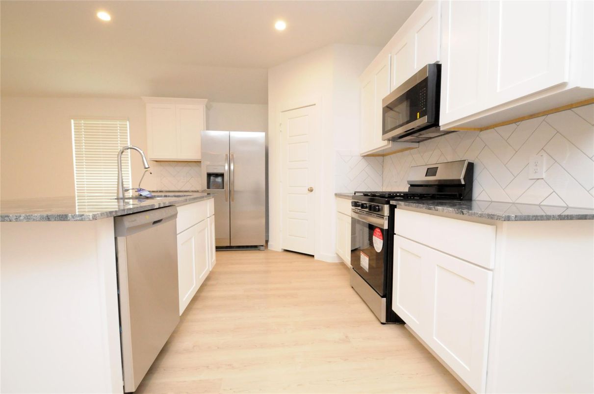 Interior, Kitchen, Recessed Lighting, Stainless Steel Appliances, Wood Texture Flooring