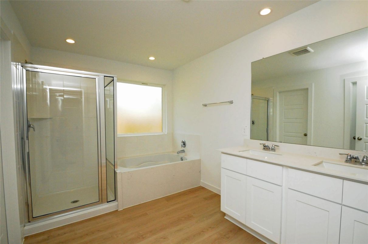 Bathroom, Dual Sink Vanities, Glass Shower, Interior, Recessed Lighting, Wood Texture Flooring