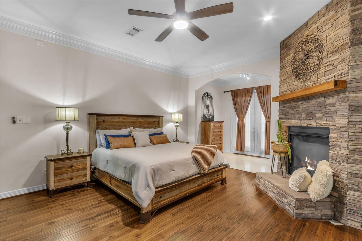 Bedroom, Fireplace, Interior, Recessed Lighting, Stone Walls, Wood Texture Flooring