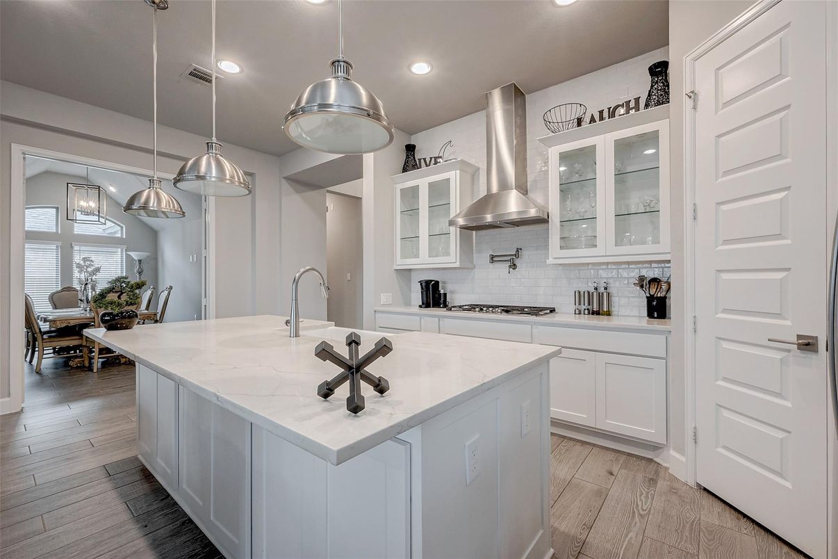 Dining room, Interior, Kitchen, Pendant Lights, Recessed Lighting, Stainless Steel Appliances, Wood Texture Flooring